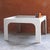 Elegant square coffee table with rounded corners, made of polyester-reinforced fiberglass and lacquered in white. France,...