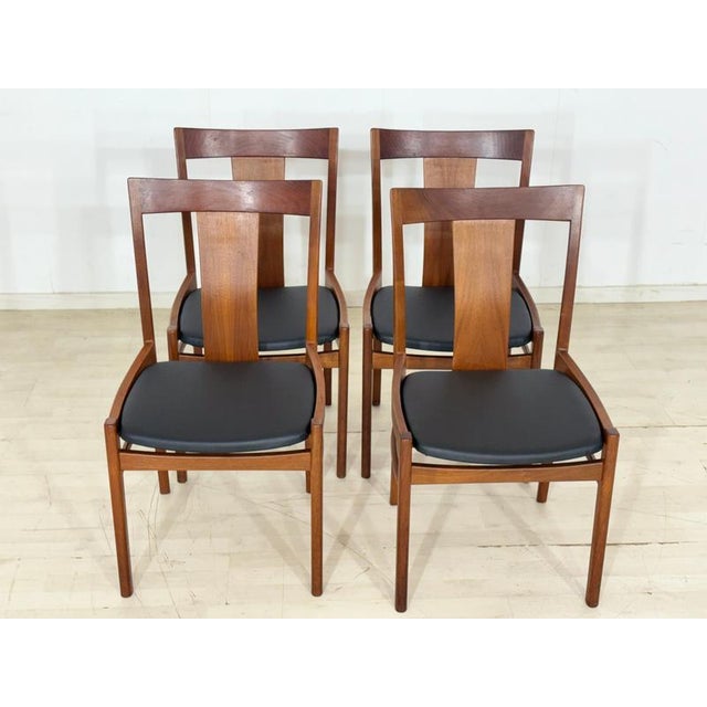 For sale is this beautiful set of four Scandinavian mid-century dining chairs made of high-quality teak. The distinctive...
