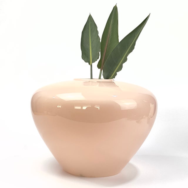 Elevate your space with a gorgeous touch of 1980s postmodernism. This stunning cased art glass urn vase was designed by...