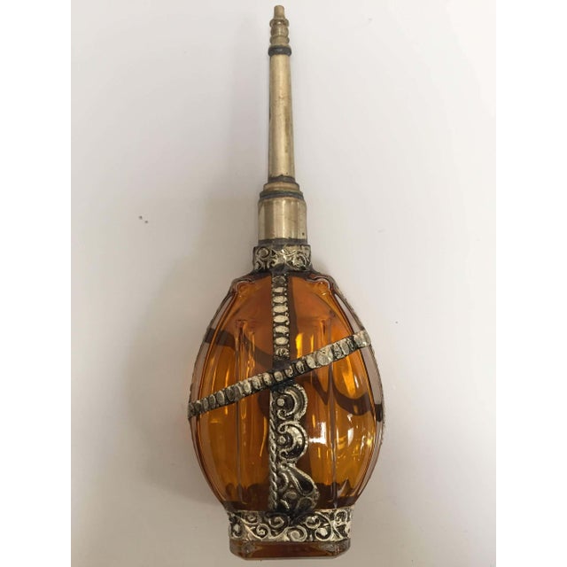 Handcrafted Moroccan Moorish glass perfume bottle or rose water sprinkler with raised embossed silvered metal floral...