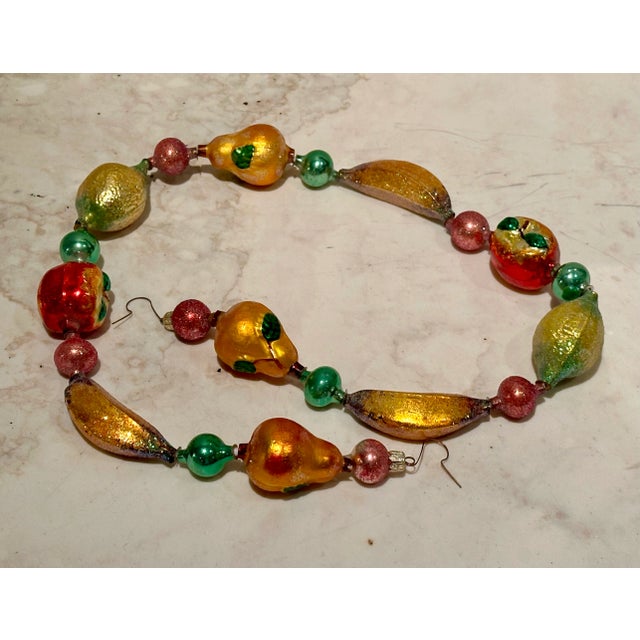 Stunning rare vintage Christopher Radko hand-blown "Della Robbia" fruit garland in original box. Includes pears, apples,...