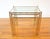 This is a set of 3 mid century modern brass and glass Hollywood Regency style nesting tables with a faux bamboo design....