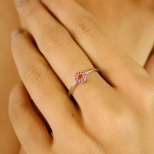 Elevate your everyday style with this minimalist open circle ring, crafted in lustrous 14K white gold. Adorned with 0.05...