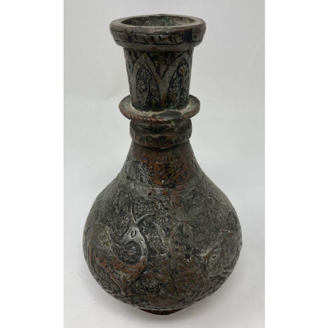 Antique Islamic metal copper hookah bottle base of spherical form and decorated with a recessed repeated floral, geometric...