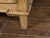 A French Louis XVI style bleached oak chest from the 19th century, with three drawers, carved panels, brass hardware and...