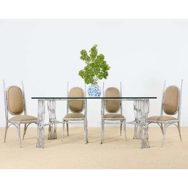 Rare set of four mid-century modern cast and welded aluminum dining sable chairs designed by Arthur Court. The chairs...