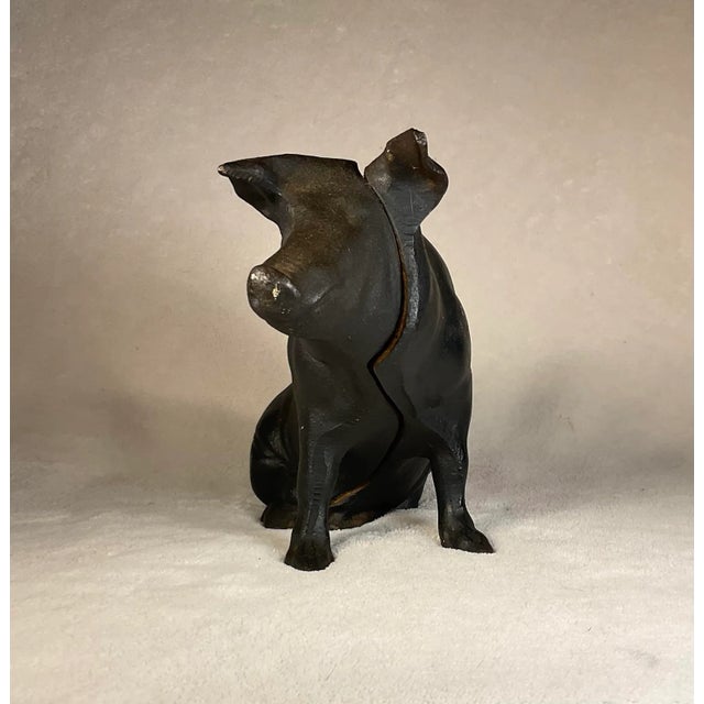 Large American made 1800’s cast iron money box in the shape of a pig. Awesome detail’s due to this one being one of the...