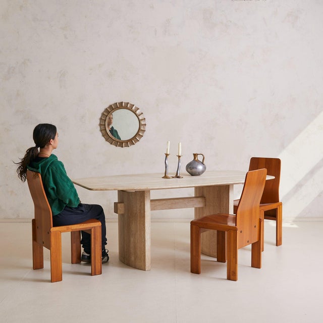 A study in substance and restraint, this 1970s Italian dining table brings sculptural stillness to the room. Hewn from...
