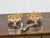 A pair of 19th century French giltwood fragments transformed into modern, sculptural table lamps, mounted on custom lucite...