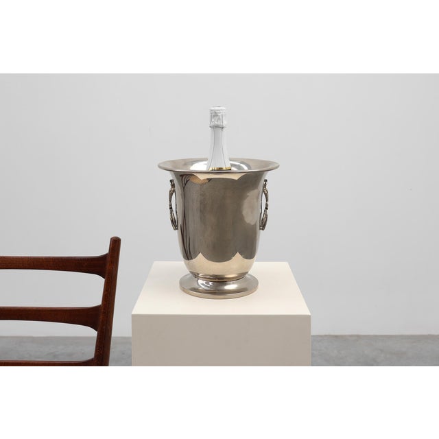 A refined Art Deco equestrian‑themed champagne bucket, crafted in France in the 1930s, distinguished by its sculptural...