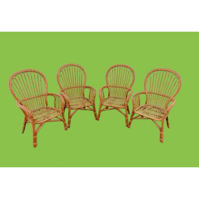 Fantastic set of 4 Franco Albini’s style dining armchairs or lounge chairs. Organic modern natural rattan with woven...