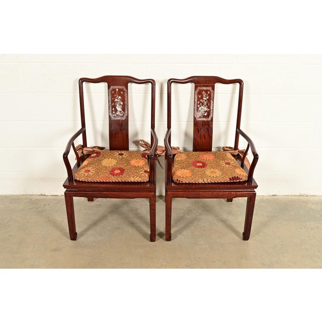 An outstanding pair of antique Chinese armchairs or dining captain chairs China, Circa 1890s Gorgeous carved rosewood,...