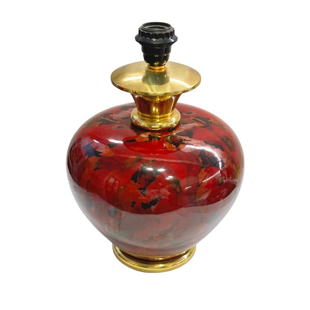 A striking vintage table lamp by Maison Dauphin, featuring a generously proportioned ceramic body finished in a rich,...
