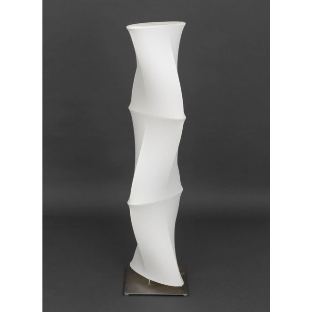 Roche Bobois Dix Heures Dix Minoluce Floor Lamp, with white stretch fabric on stainless steel base, label to underside....