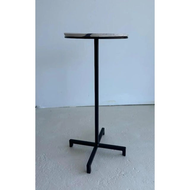 This accent table is simple yet elegant in form and materials. The base and table stem is waxed cold rolled steel. The top...
