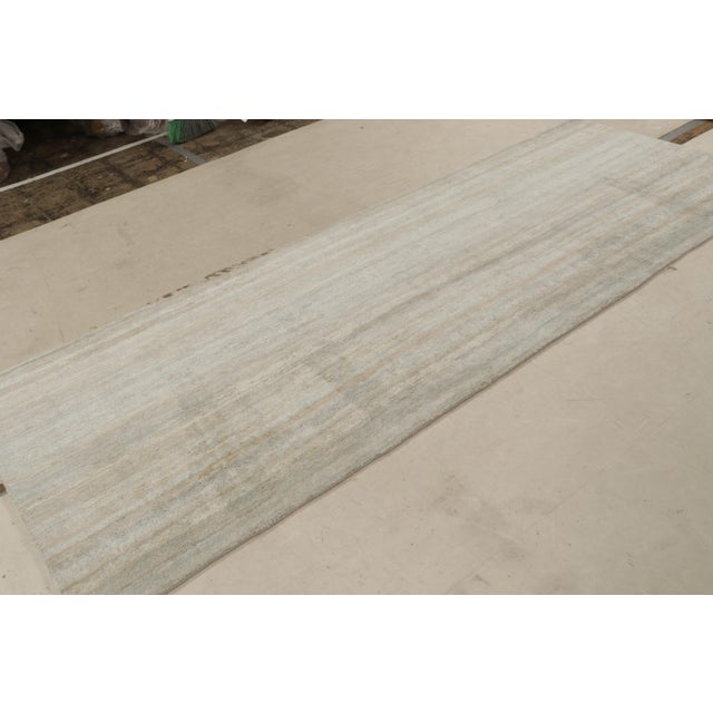 Hand knotted in a lustrous silk, this 4×10 runner rug hails from the Texture of Color Collection by Rug & Kilim,...
