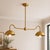 Crafted from solid heavy-gauge brass, this double-arm chandelier features two softly curved dome shades suspended from a...