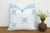 An eight-point star medallion, hand block-printed in jewel blue, sits crisply across a pristine white linen ground on this...