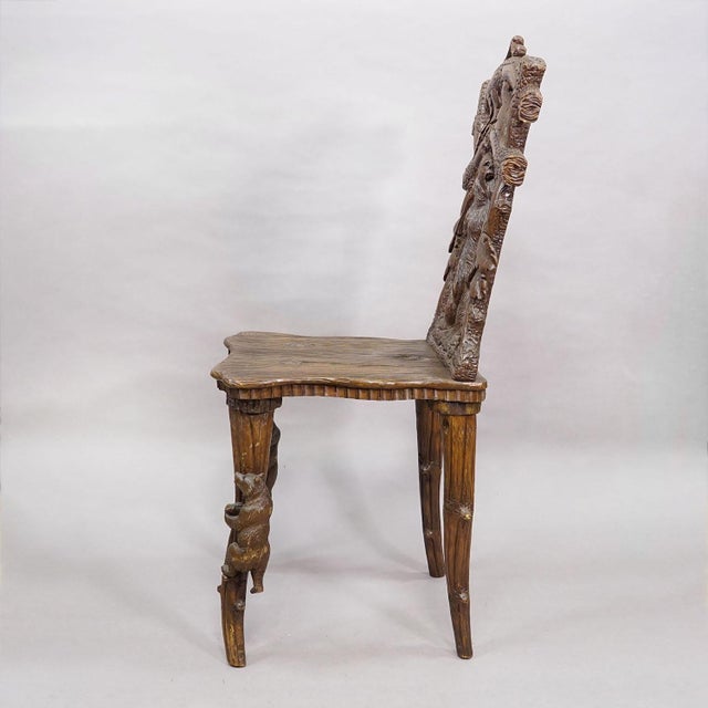 Antique Black Forest Carved Bear Chair, Brienz, circa 1880s An exceptional hand-carved Black Forest bear chair dating to...