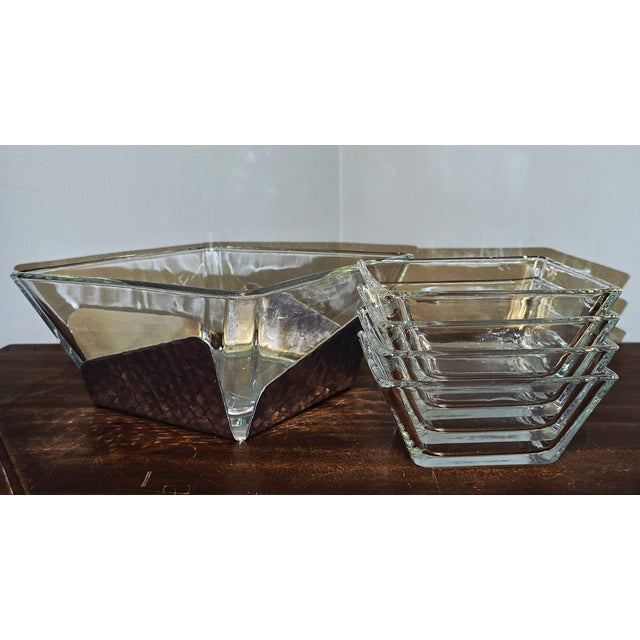A beautifully crafted mid‑century serving set by Wendell August Forge, the renowned Pennsylvania metalworks studio...