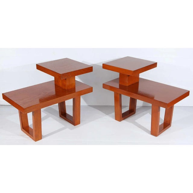 1950's Sleek Pair of Telephone Tables This pair of mid-century oak wood telephone tables are in great vintage condition....