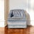 A charismatic vintage swivel lounge chair upholstered in blue striped velvet, pairing a compact rounded silhouette with...