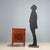 Neoclassical nightstand in various veneers, transformed into a charming bar cabinet. Featuring a top flap that reveals a...