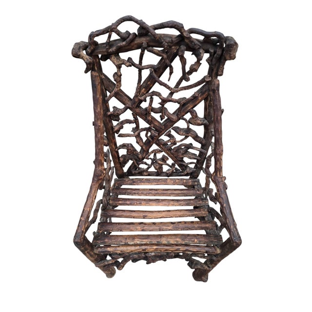 Antique Rustic Handcrafted Adirondack Child's Chair A charming antique handcrafted Adirondack child’s chair, constructed...