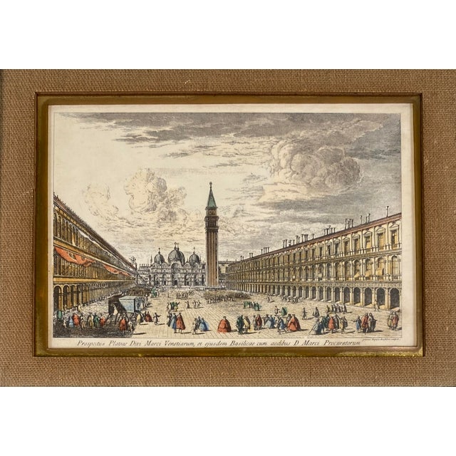 An elegant and highly decorative set of four antique Italian hand-colored engravings depicting celebrated views of Venice,...