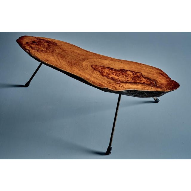 An organic, sculptural coffee table by Carl Auböck, made from a single walnut slab with a rich natural grain and polished...