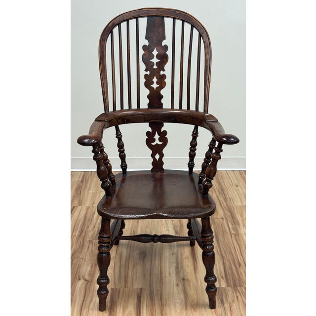 Absolutely stunning antique carved wood Windsor chair. Loads of character with this substantial chair. High rounded back...