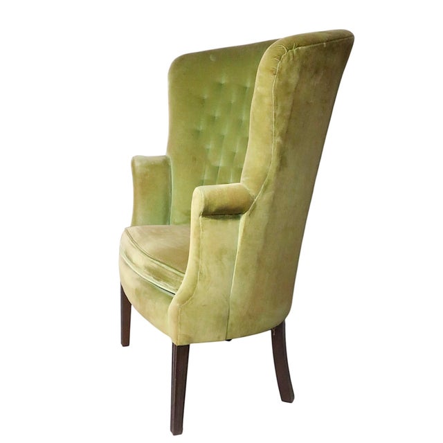 Classic English Regency Revival style wing chair, made in the USA circa 1930/60's. The chair is structurally sound and...