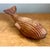 This vintage sculpture is hand-carved from a single piece of solid wood into the fluid, streamlined form of a whale. The...
