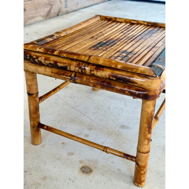 Charming vintage bamboo stool featuring a classic scorched finish and clean, versatile lines. Perfect as a decorative...