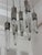 sophisticated architectural lighting installation featuring ten ET2 Quartz pendants in polished chrome with beautifully...