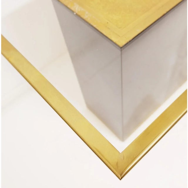 Measures : 46cmx65cm H:46cm Materials : Brass - Glass - Melamine wood.