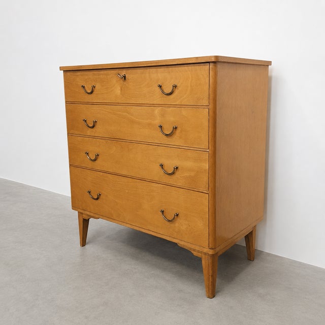Vintage birch chest of drawers produced by Imexcotra in Belgium during the 1960s. The piece features four drawers,...