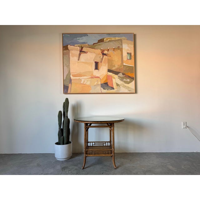 Elevate your space with this stunning vintage McGuire rattan occasional table, featuring a circular design and a sleek...