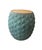 This drum-form side table offers a compelling blend of organic texture and industrial materiality. The base is crafted...