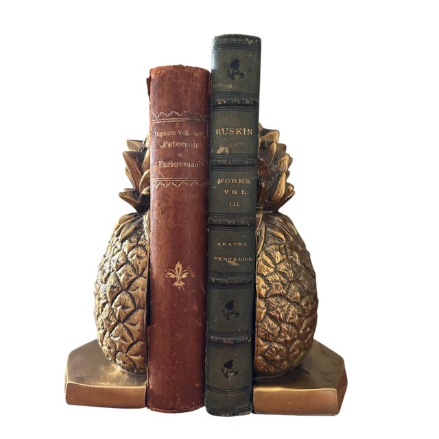 A striking pair of vintage solid brass pineapple bookends by Victor, celebrated for their sculptural presence and timeless...
