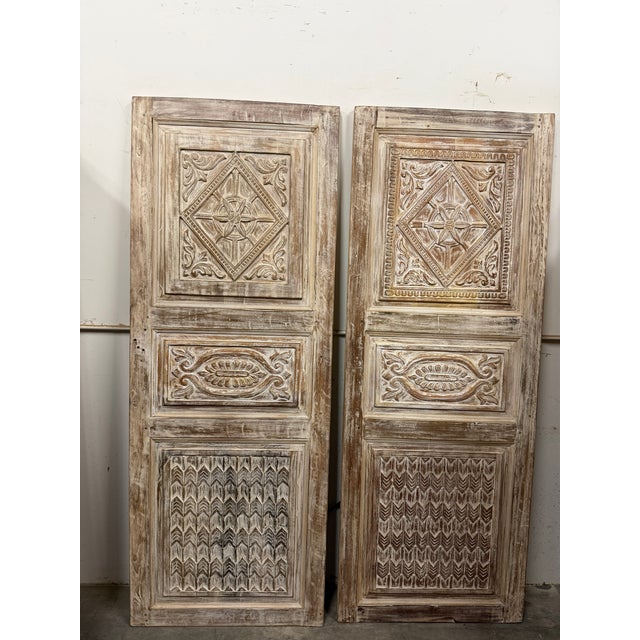 Elevate your space with this vintage whitewashed carved wood door, a stunning blend of rustic charm and timeless...
