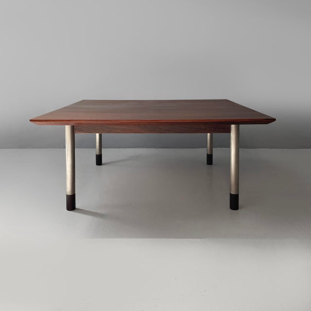 Italian mid-century modern coffe table in wood and metal, 1960s Coffee table with a square wooden top. The round chrome-...