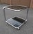 Vintage Italian Chrome and Smoked Glass Rolling Side Table, 1970s, in Good conditions. Designed 1970 to 1979