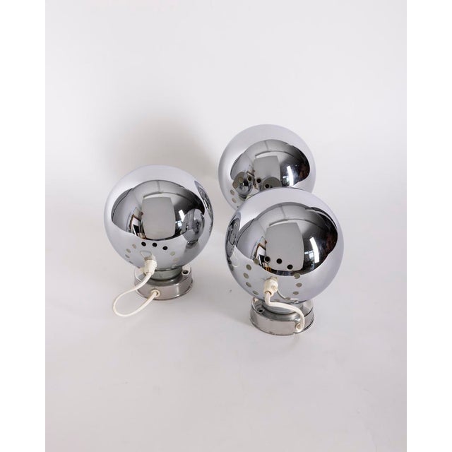 Set of 3 "Eyeball" wall lamps in chromed metal, adjustable with a magnet, designed by Goffredo Reggiani, 1970s.,Set of 3...