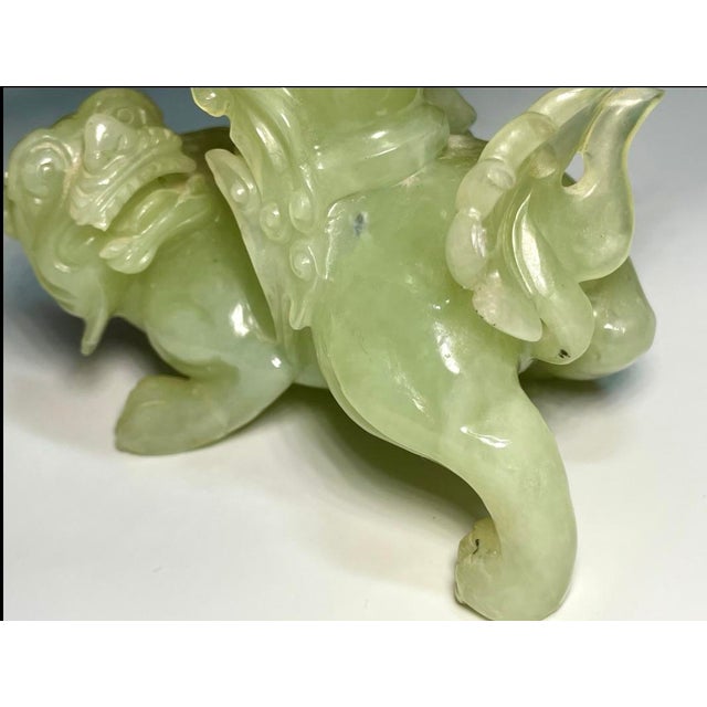 Sculpted jade foo dog open urn. Very translucent celadon jadeite, originating from the mid twentieth century. The item...