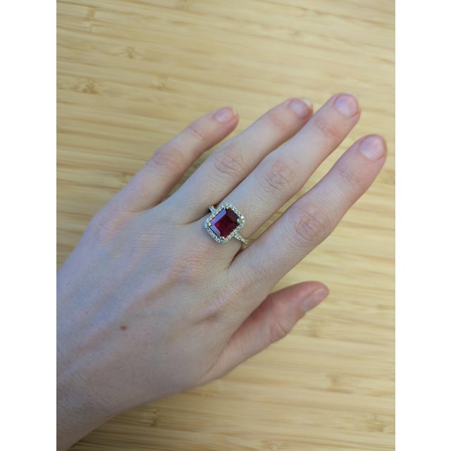 Radiating timeless beauty, this 4.25-carat Madagascar ruby shines at the heart of a sparkling earth-mined diamond halo....