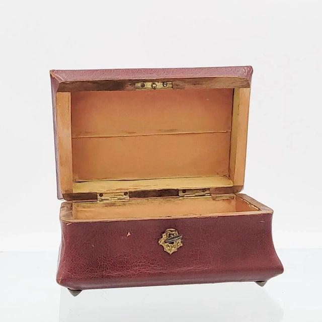 A leather and gilt tea caddy, England circa 1830.