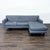 This Room & Board Andre sectional features a modern design with clean lines and a stylish grey fabric. The chaise is...