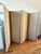 Custom 4-panel folding screen upholstered in a creamy-beige velvet with picture frame gilt tape trim on face. Panels are...
