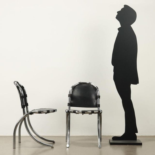 Group of 4 chairs, chrome-plated metal and leather. Good condition. This piece is attributed to the mentioned...